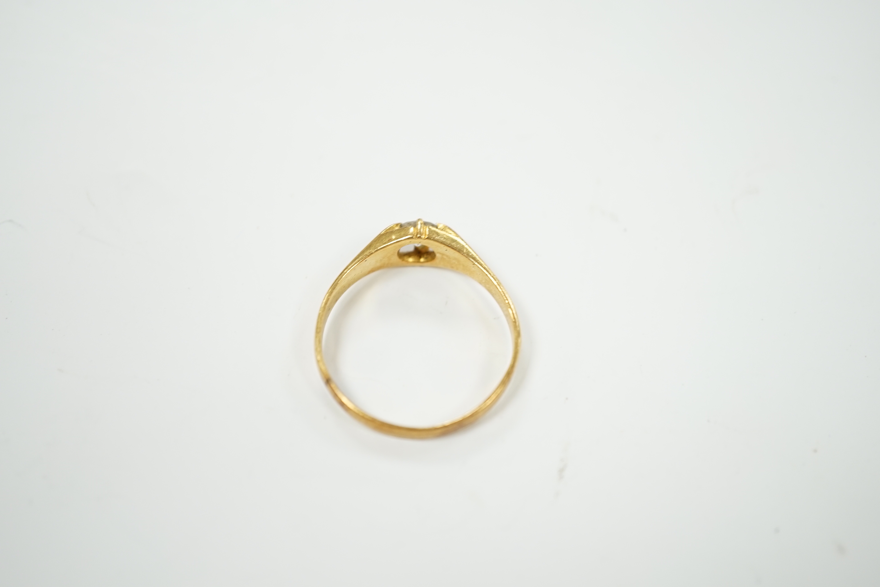 A George V 18ct gold and claw set solitaire diamond ring, size U/V, gross weight 3.6 grams.